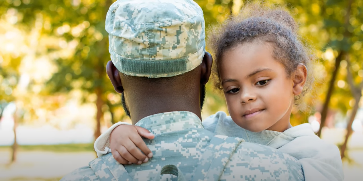 Soldier with his young daughter